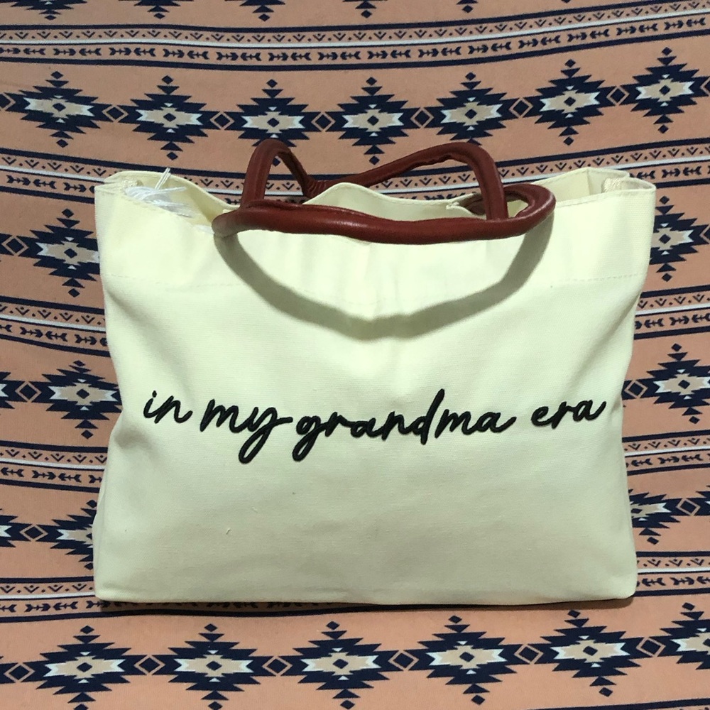 Canvas Tote Bag "in my grandma era" — Cream with Brown Handles snap button.